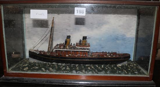 A small cased steam boat